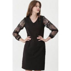 Czarna Sukienka Dusty Bun. Czarne sukienki damskie Born2be, na wiosnę, xl, bez wzorów, z tkaniny, wizytowe, bez kołnierzyka, bez rękawów. Za 99,99 zł.