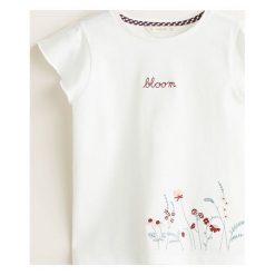 Mango Kids - Top dziecięcy Bloom 110-164 cm. Białe bluzki dziewczęce Mango Kids, z haftami, z bawełny, z okrągłym kołnierzem, z krótkim rękawem, krótkie, bez kaptura. Za 49,90 zł.