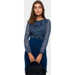 Bluzka elegancka z błyszczącą nitką - 38. Bluzki damskie e-margeritka.pl, bez wzorów, z tkaniny, eleganckie, z falbankami, bez rękawów. Za 99,99 zł.
