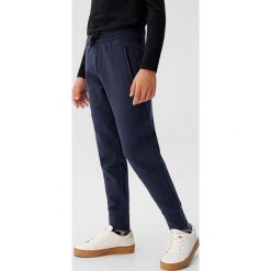 Mango Kids - Spodnie dziecięce Guillem 110-164 cm. Czarne dresy chłopięce Mango Kids, bez wzorów, z bawełny. Za 69,99 zł.
