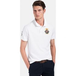 Koszulka polo w kolorze białym. Białe koszulki męskie Polo Club Men, m, z haftami, z bawełny, polo, bez rękawów. W wyprzedaży za 122,95 zł.