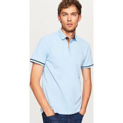 Koszulka polo - Niebieski. Niebieskie koszulki polo Reserved, l. Za 79,99 zł.