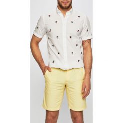 Tommy Hilfiger - Szorty. Żółte spodenki i szorty męskie TOMMY HILFIGER, bez wzorów, z bawełny, casualowe. W wyprzedaży za 239,90 zł.