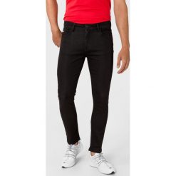 Philipp Plein Sport Statement Dżinsy Czarny. Czarne jeansy męskie Philipp Plein Sport, l, bez wzorów, sportowe. Za 1005,95 zł.