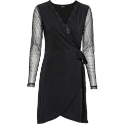 Sukienka shirtowa z efektem założenia kopertowego bonprix czarny. Czarne sukienki damskie bonprix, w paski, z koronki, z dekoltem w serek, bez rękawów, kopertowe. Za 109,99 zł.