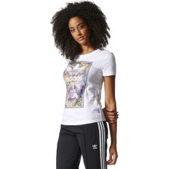 Adidas Koszulka damska Tongue L Tee biała r. 36 (BK2314). Szare topy sportowe damskie marki Adidas, l, z dresówki, na jogę i pilates. Za 116,59 zł.