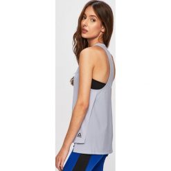 Reebok - Top. Niebieskie topy damskie Reebok, xs, bez wzorów, z poliesteru, bez kołnierzyka. Za 79,90 zł.