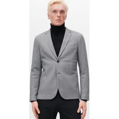 Marynarka slim ze strukturalnej dzianiny - Niebieski. Niebieskie marynarki męskie Reserved, s, bez wzorów, z dzianiny. Za 239,99 zł.