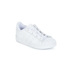 Buty Dziecko adidas SUPERSTAR I. Białe trampki chłopięce marki Adidas, bez wzorów, bez zapięcia. Za 191,20 zł.