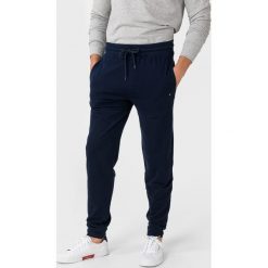 Tommy Hilfiger Spodnie dresowe Niebieski. Niebieskie spodnie męskie TOMMY HILFIGER, s, bez wzorów, z bawełny. Za 280,95 zł.