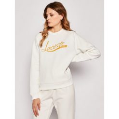 Bluza Lacoste SF5638. Białe bluzy damskie Lacoste, bez wzorów, z elastanu, bez rękawów, bez kaptura. W wyprzedaży za 429,00 zł.