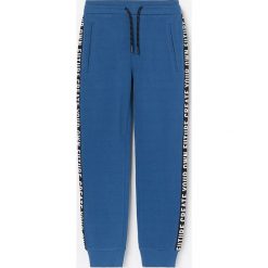 Joggery z lampasami - Granatowy. Niebieskie spodnie męskie Reserved, bez wzorów. Za 59,99 zł.