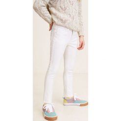 Mango Kids - Jeansy dziecięce Patri 104-164 cm. Różowe jeansy dziewczęce marki Mango Kids, bez wzorów, z elastanu. Za 89,90 zł.