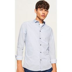 Koszula z mikroprintem regular fit - Niebieski. Niebieskie koszule męskie marki Reserved, l. Za 89,99 zł.