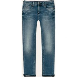 Tommy Hilfiger - Jeansy dziecięce Scanton 128-176 cm. Niebieskie spodnie chłopięce TOMMY HILFIGER, bez wzorów, z elastanu. Za 299,90 zł.
