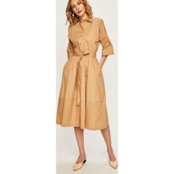 Dkny - Sukienka. Pomarańczowe sukienki damskie DKNY, na co dzień, xs, bez wzorów, z elastanu, casualowe, bez kołnierzyka, z krótkim rękawem, krótkie, midi, rozkloszowane. W wyprzedaży za 769,90 zł.