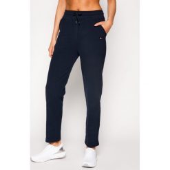 Spodnie dresowe TOMMY HILFIGER UW0UW01279. Niebieskie spodnie damskie TOMMY HILFIGER, s, z dresówki. Za 279,00 zł.