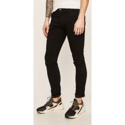 G-Star Raw - Jeansy Rackam. Czarne jeansy męskie G-Star RAW, z aplikacjami, retro. W wyprzedaży za 559,90 zł.