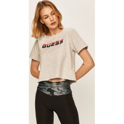 Guess Jeans - T-shirt. Czarne bluzki damskie Guess Jeans, s, z nadrukiem, z bawełny, casualowe, z okrągłym kołnierzem. W wyprzedaży za 79,90 zł.