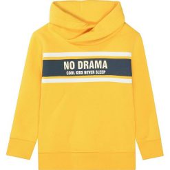 Bluza w kolorze żółtym. Żółte bluzy niemowlęce Attention, z nadrukiem, z bawełny, bez rękawów, bez kaptura. W wyprzedaży za 42,95 zł.