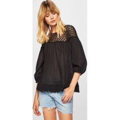 Levi's - Bluzka. Czarne bluzki damskie Levi's®, s, bez wzorów, z bawełny, z okrągłym kołnierzem, bez rękawów. W wyprzedaży za 239,90 zł.