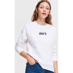 Bluza z napisem - Kremowy. Białe bluzy damskie Reserved, s, z napisami, bez rękawów, bez kaptura. Za 39,99 zł.