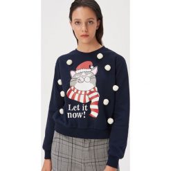 Świąteczny sweter z pomponami - Granatowy. Niebieskie swetry damskie Sinsay, s, bez wzorów, wizytowe, bez rękawów, bez kaptura. Za 49,99 zł.