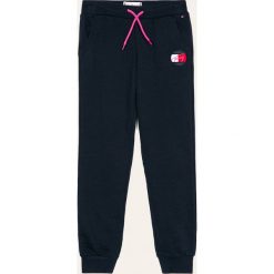 Tommy Hilfiger - Spodnie dziecięce 140-176 cm. Niebieskie spodnie dziewczęce TOMMY HILFIGER, bez wzorów, z elastanu. Za 269,90 zł.
