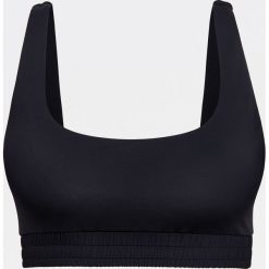 Top od bikini w sportowym stylu -. Topy sportowe damskie Reserved, bez wzorów, bez rękawów. W wyprzedaży za 29,99 zł.