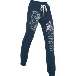 Spodnie sportowe, długie, Level 1 bonprix ciemnoniebieski z nadrukiem. Czerwone spodnie sportowe damskie marki DOMYOS, xs, z bawełny. Za 89,99 zł.