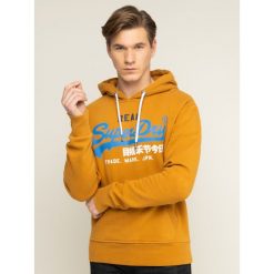 Bluza Superdry Vl Desert Hood M2000130A. Niebieskie bluzy męskie Superdry, s, bez wzorów, z bawełny, bez kołnierzyka, bez rękawów, bez kaptura. W wyprzedaży za 269,00 zł.