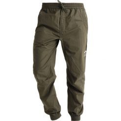 Spodnie dresowe męskie: Maharishi SEAMLESS TRACK PANTS Spodnie treningowe mil olive