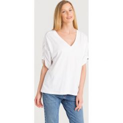 BLUZKA FIACRE Sportmax Code. Białe bluzki damskie Sportmax Code, s, z aplikacjami, z bawełny, bez kołnierzyka, bez rękawów. Za 317,40 zł.