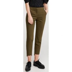 Spodnie z asymetrycznymi nogawkami - Khaki. Brązowe spodnie damskie Reserved. Za 119,99 zł.