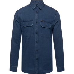 Koszula Calvin Klein Jeans J30J312588. Niebieskie koszule męskie Calvin Klein Jeans, s, bez wzorów, z bawełny, casualowe, bez kołnierzyka, bez rękawów. W wyprzedaży za 209,00 zł.