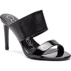 Klapki CALVIN KLEIN - Rema E8926 Black. Czarne klapki damskie Calvin Klein, bez wzorów, ze skóry ekologicznej, bez obcasa, na obcasie. Za 629,00 zł.