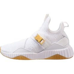 Puma DEFY MID VARSITY Obuwie treningowe white/metallic gold. Białe buty sportowe damskie marki Puma, z materiału. Za 459,00 zł.