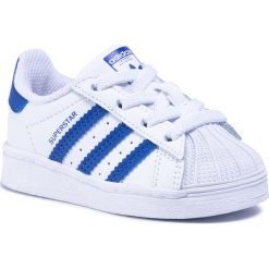 Buty adidas - Superstar El I FW0768 Ftwwht/Royblu/Ftwwht. Białe półbuty dziewczęce Adidas, bez zapięcia. Za 229,00 zł.