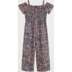 Mango Kids - Kombinezon dziecięcy Costa 110-164 cm. Niebieskie kombinezony dziewczęce Mango Kids, w kwiaty, z bawełny, z krótkim rękawem, krótkie. W wyprzedaży za 103,90 zł.