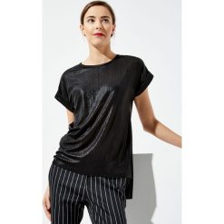 Bluzka oversize. Bluzki damskie Moodo, xs, bez wzorów, bez kołnierzyka, bez rękawów. Za 9,99 zł.