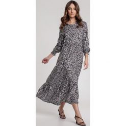Czarna Sukienka Helipheme. Czarne sukienki damskie Renee, s, z aplikacjami, klasyczne, z okrągłym kołnierzem, z długim rękawem, długie, midi. Za 99,99 zł.
