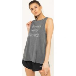 Koszulka techniczna NIKE Yoga BV4371. Szare koszulki damskie polo Nike, xs, bez wzorów, z poliesteru, bez rękawów. W wyprzedaży za 109,00 zł.