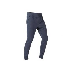 Spodnie dresowe skinny Gym & Pilates 500 zip niebieskie męskie. Niebieskie spodnie męskie DOMYOS, m, bez wzorów, z elastanu. Za 64,99 zł.