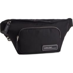 Saszetka nerka CALVIN KLEIN - Primary Waist Bag K50K504595 001. Czarne nerki damskie Calvin Klein, bez wzorów, z materiału, młodzieżowe, bez dodatków. Za 299,00 zł.
