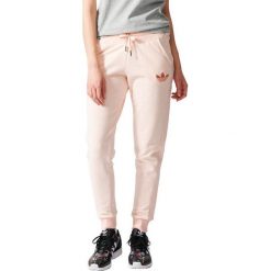 Spodnie sportowe damskie: Adidas Spodnie Slim Trackpant beżowe r. L (S19745)