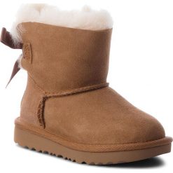 Buty UGG - T Mini Bailey Bow II 1017397T T/Che. Pomarańczowe śniegowce dziewczęce Ugg, bez zapięcia. Za 589,00 zł.