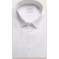 Calvin Klein - Koszula. Białe koszule męskie Calvin Klein, bez wzorów, z elastanu, eleganckie, z klasycznym kołnierzykiem, z długim rękawem. Za 349,90 zł.
