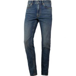 J.LINDEBERG DAMIEN DUST Jeans Skinny Fit mid blue. Niebieskie jeansy męskie marki J.LINDEBERG, m, bez wzorów. Za 569,00 zł.