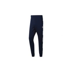 Legginsy i Rajstopy Reebok Classic Spodnie Classics French Terry Taped. Niebieskie spodnie męskie Reebok Classic, xl, bez wzorów. Za 229,00 zł.