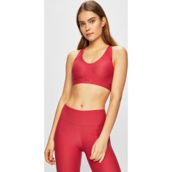 Under Armour - Biustonosz sportowy. Różowe biustonosze sportowe damskie Under Armour, xs, bez wzorów, z elastanu. W wyprzedaży za 139,90 zł.